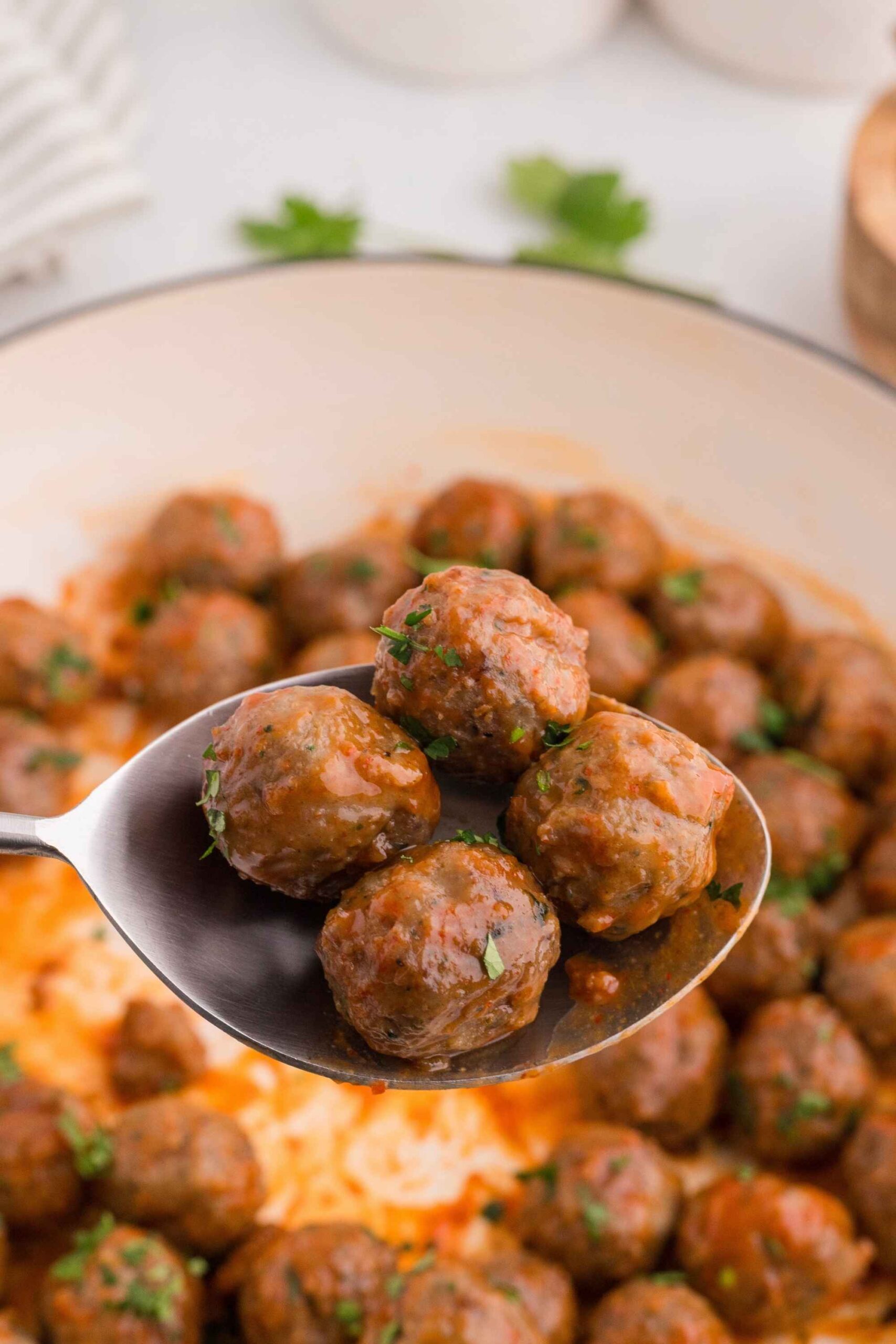 sriracha meatballs on spoon